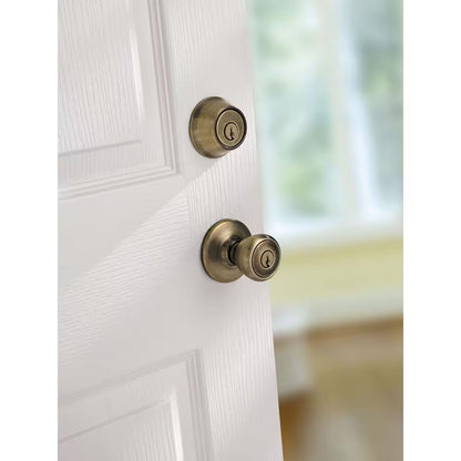 Tylo Antique Brass Entry Door Knob and Single Cylinder Deadbolt Combo Pack with Microban Antimicrobial Technology